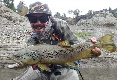 Jans fly fishing guide Dave Mihalik smiles big with his latest catch.