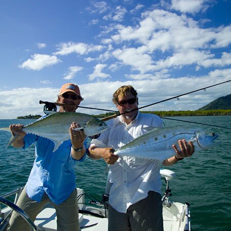 Clients show off their catch in the waters off of the coast of Carpentaria Seafaris, Australia.