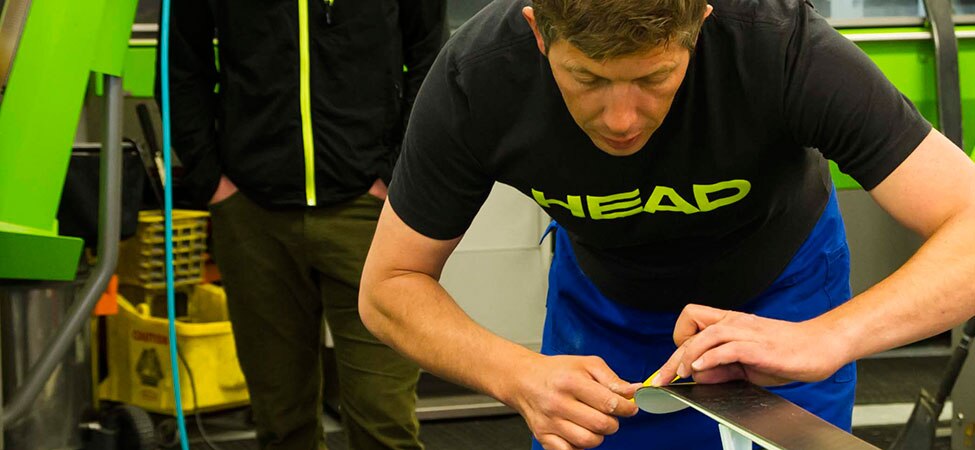 Alex Martin hand-tuning race skis