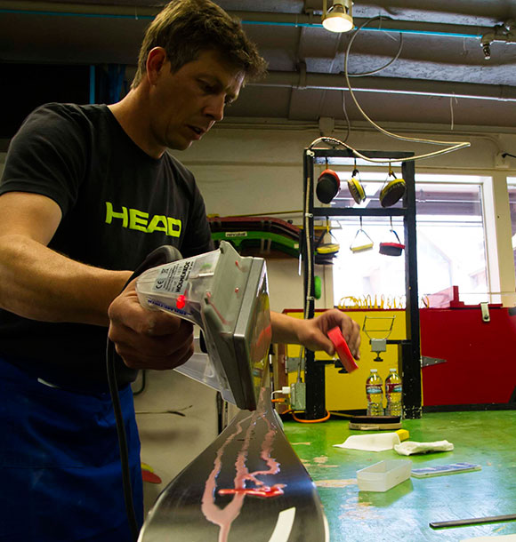 Alex Martin waxing race skis