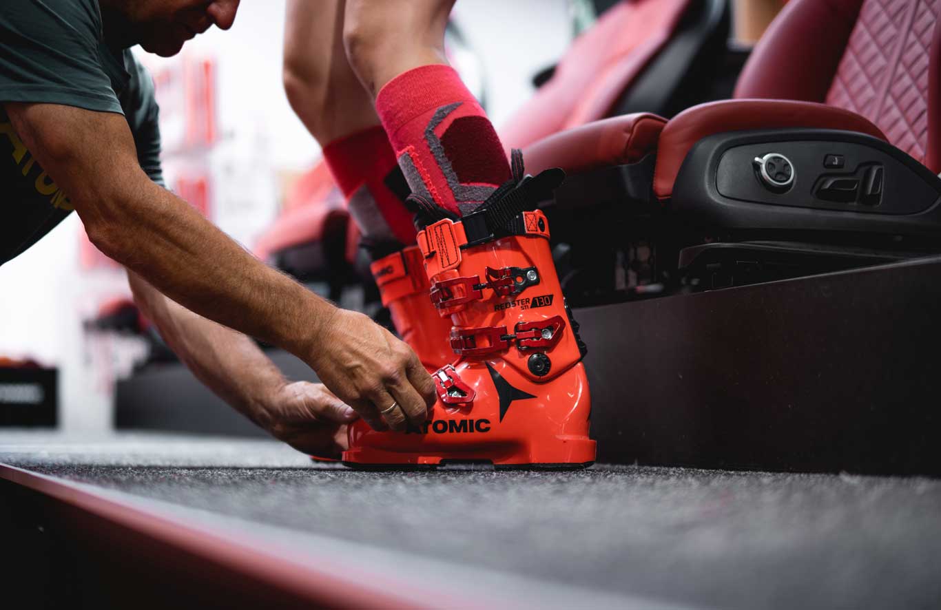 A bootfitter works on a boot for a customer at the Atomic Pro center.