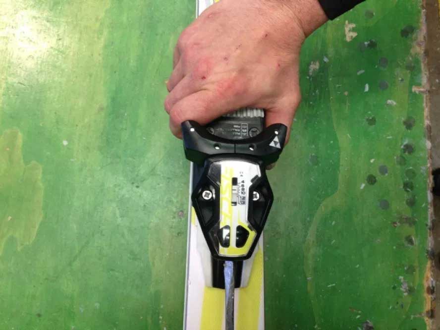 Turning down the DINs on a pair of skis.