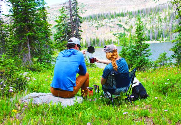 Jans experts boiling water to make a backpacking dinner in the Uinta Mountains, Utah.