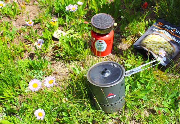 A MSR canister backpacking stove with integrated cooking pot.