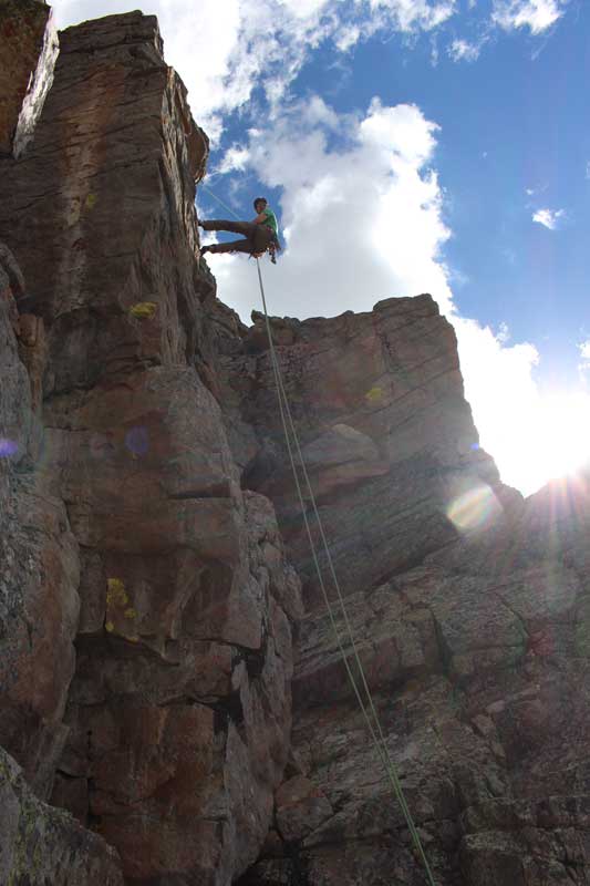 A Jans expert repelling down a route. Uinta Mountains, Utah.