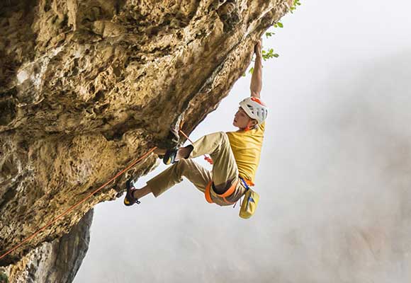 A rock climber leading a route. Image courtesy of Petzl.