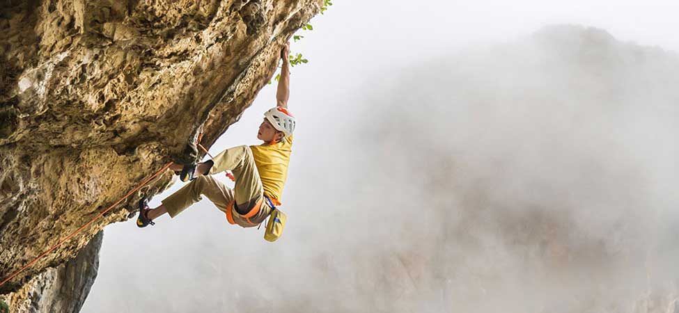 A rock climber leading a route. Image courtesy of Petzl.