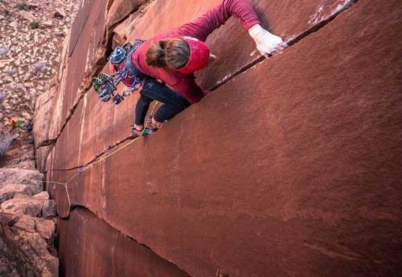 Trad climber ascends a crack. Image courtesy of Black Diamond. 