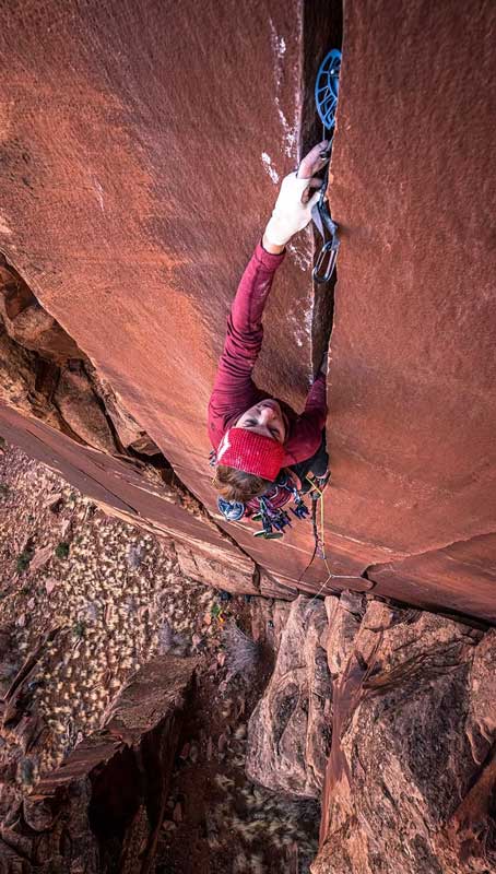 A climber inserts a SLCD into a crack. Image courtesy of Black Diamond.