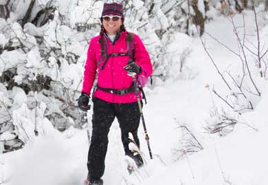 Jans mountain guide Betsy Bothe snowshoeing on Spiro Trail in Park City, Utah.