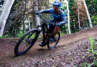 Jans expert Chris Brown rounds a corner, while mountain biking in Park City, Utah.
