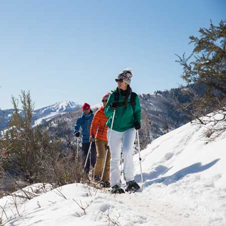 Jans guide and clients snowshoe up Rob’s Trail in Park City, Utah.