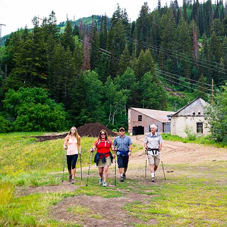 Jans hiking guide leads a tour past an old mining site in Park City, Utah.