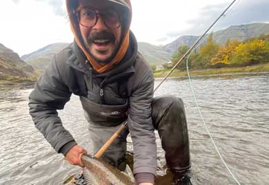 Jans fly fishing guide, Dave Mihalik (Danger Dave), holding a large brown trout caught in a river near Park City, UT
