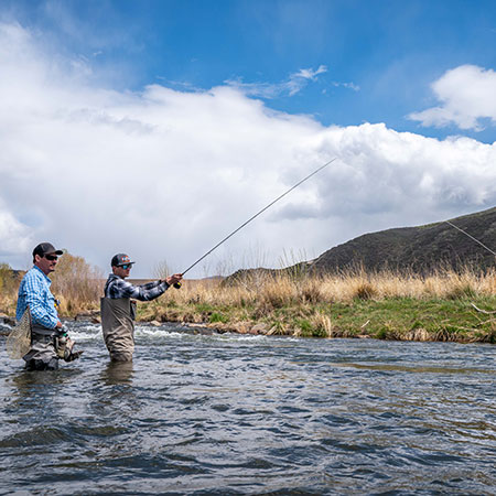 fly fishing guide and customer wade in the Weber River