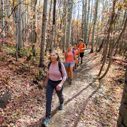 Jans hiking guide Andrea Putt leads a tour on Armstrong Trail in Park City, Utah.