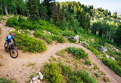 Jans expert Michael Watson makes his way down a winding mountain bike trail in Park City, Utah.