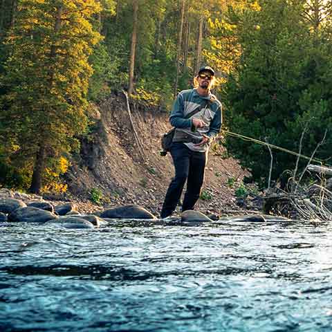 Jans fly fishing guide fishing a river in the Uinta mountains.