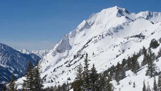 The south face of Mt. Superior in Little Cottonwood Canyon overlooking the Salt Lake valley on a sunny day.