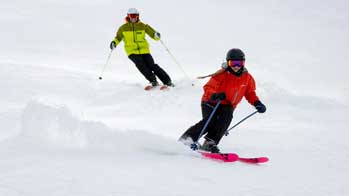 Mark Fischer and Erin McNeely Groomer Skiing in Deer Valley Resort, Park City, UT