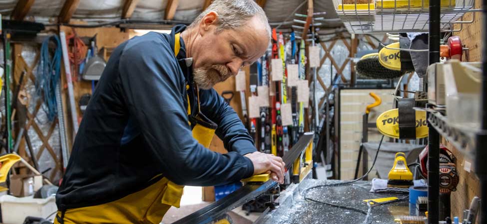 Mechanics work on bicycles in the Jans Bike Shop